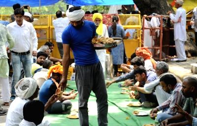 New Delhi: Supporters of the Wrestlers' protest having lunch, at Jantar Mantar, in New Delhi, on Friday, May 05, 2023. (Photo: Qamar Sibtain/IANS)